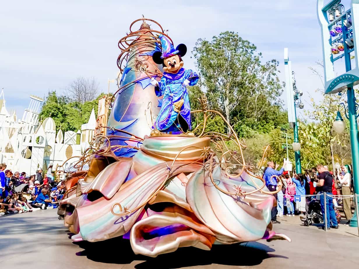 Image of Magic Happens parade going down Main Street with Mickey Mouse on the float. Photo by Jessica Sanders/The Happiest Blog on Earth.